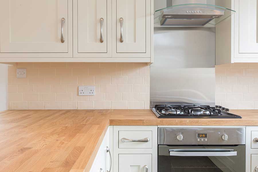 Unika Solid Wood Worktop Cleaner 500ml in a kitchen